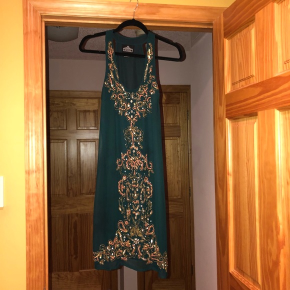 Angie Dresses & Skirts - Beautiful green racer back sequin dress! Size L